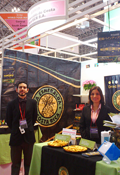 Mr. Joseph, left, of La Esmeralda in Costa Rica, who devised the elegant and eye-catching booth for dried pineapple.