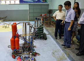 Students at Lac Hong University assemble robots. A model school and DIZA members