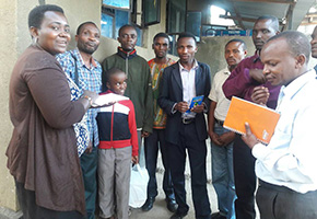 Exchanging opinions in a group of young people, which was formed to develop farming in Meru District. One of the first groups formed after returning.