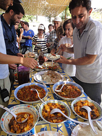 People experience regional cuisine at guesthouse during a monitoring tour.