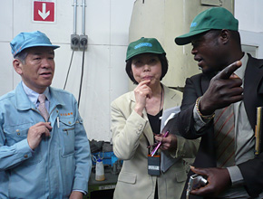 The participant stops a manager at a machine tools maker, directly asking him questions.