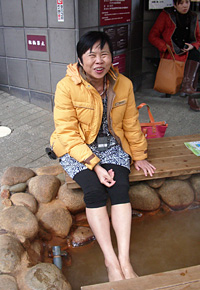 Seminar participants enjoy a footbath. This form of treatment certainly eased their fatigue.