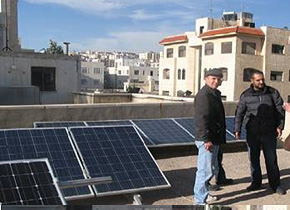 A solar-power generation system installed in Jordan. Mr. Khaldoun, a former seminar participant, is on the far right.
