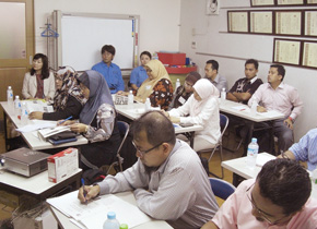 Seminar participants listen intently.