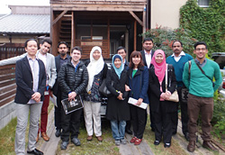 Participants stand in front of the company’s showroom. President Nishibori is on the far left.