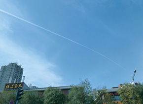The beautiful blue sky in Xian, where contrails left by airplanes can be seen