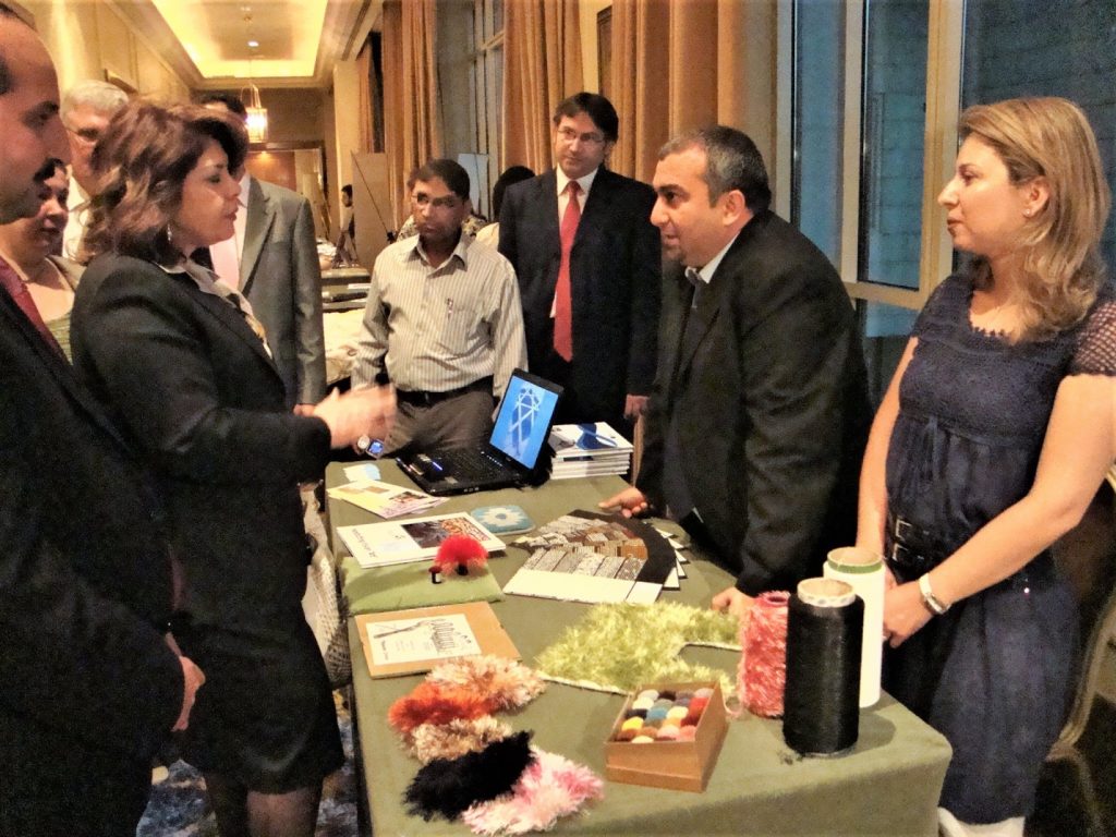 Imad HAIDAR, Owner and General Manager of Yamam Fancy Yarns & Tufts in SEBC Incubation Graduation Fair-Four Seasons Damascus Hotel, 2010, with lady minister of labor and Social Affairs